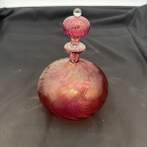 handblown art glass perfume bottle features a distinct swirled or ribbed pattern
